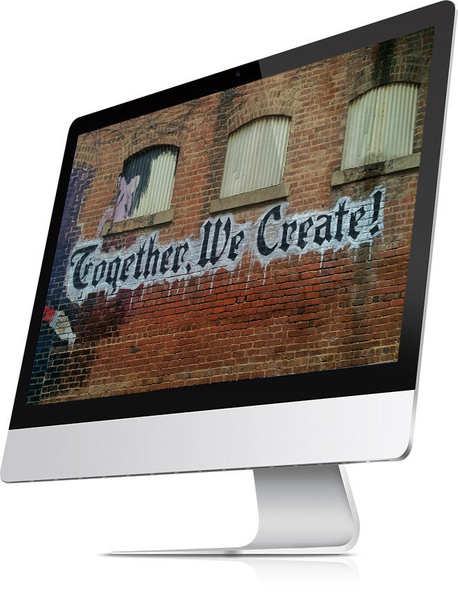 iMac screen with words "Together, We Create". It looks like the words are painted on a brick wall, graffiti style.