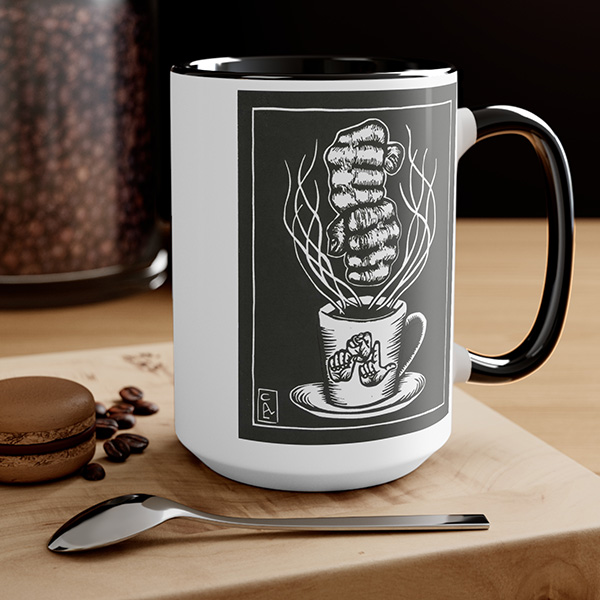 David Call linocut art "Coffee" being signed over a mug with "ASL" fingerspelled on the mug - white mug with black handle.